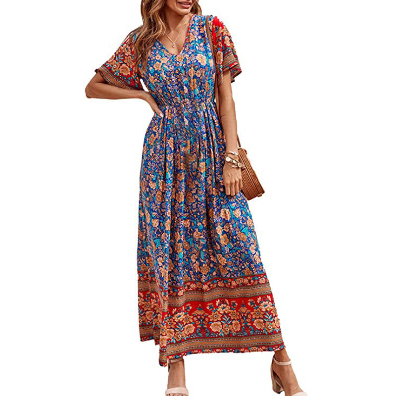 Woman wearing a colorful floral dress on a white background