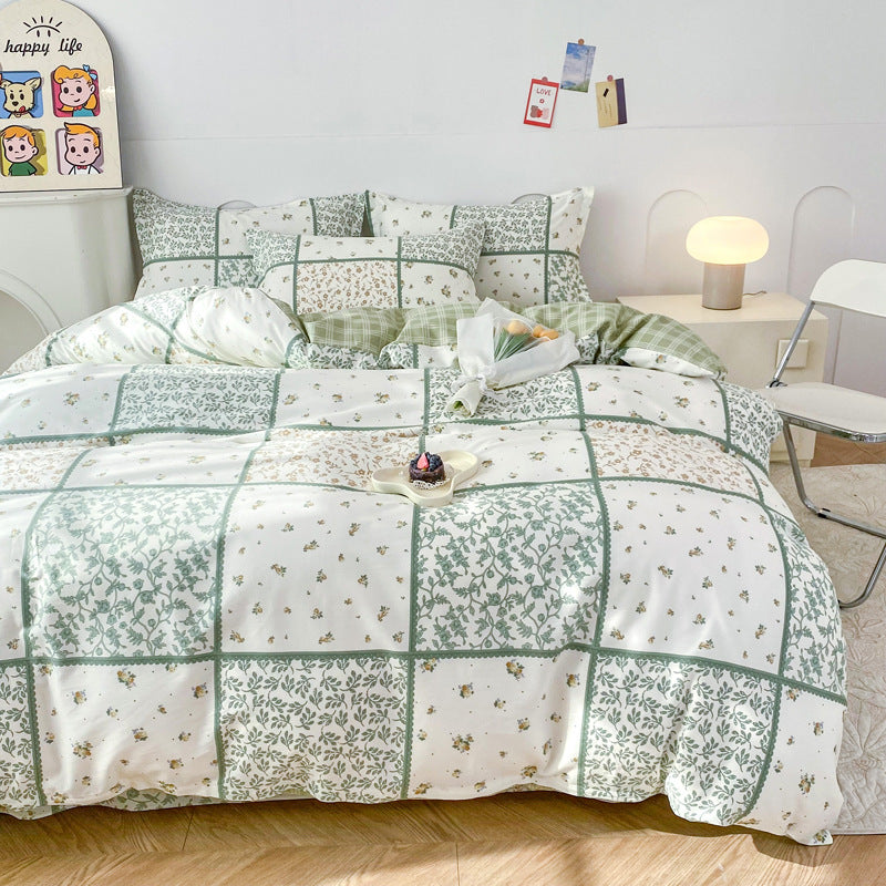Bed with green and white checkered quilt in a room setting