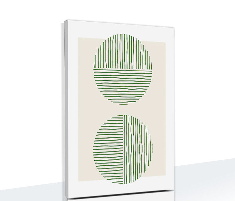 Framed artwork with green abstract design on a beige background