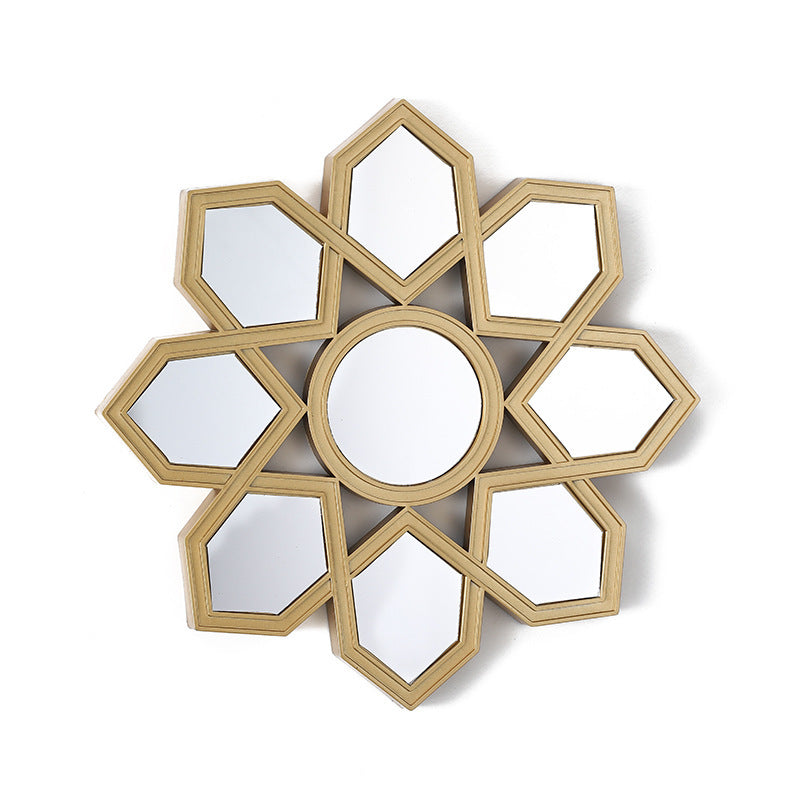 Decorative wall mirror with geometric design on a white background