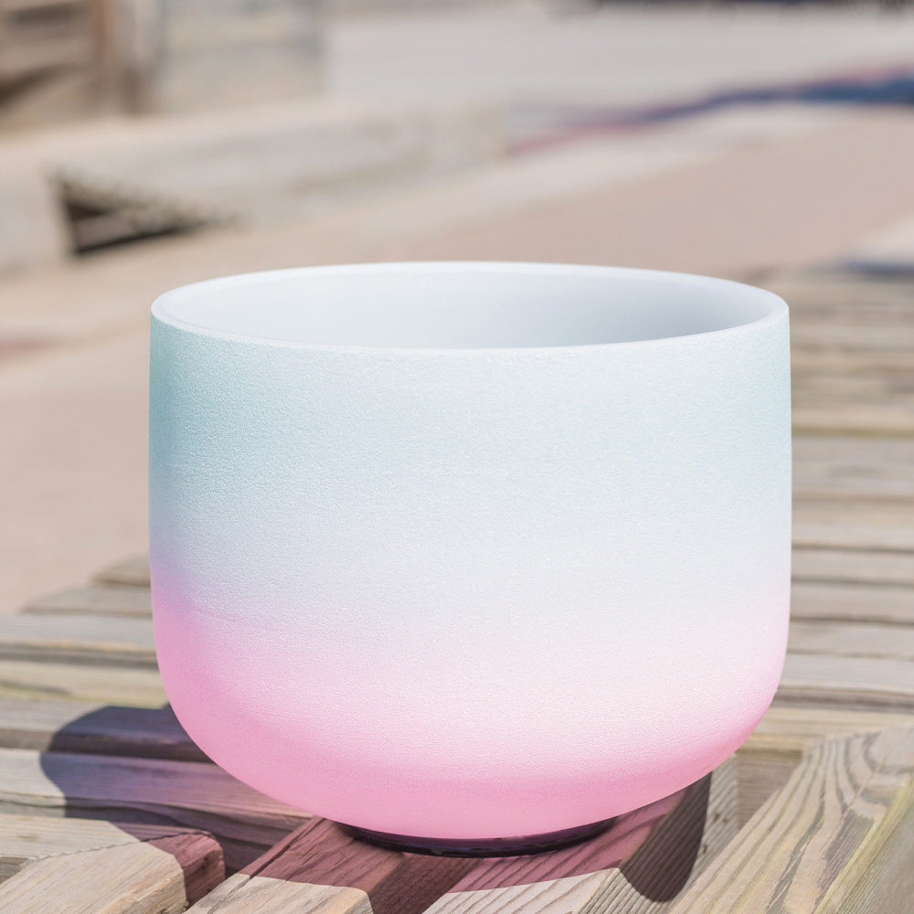 Gradient-colored bowl on a wooden surface