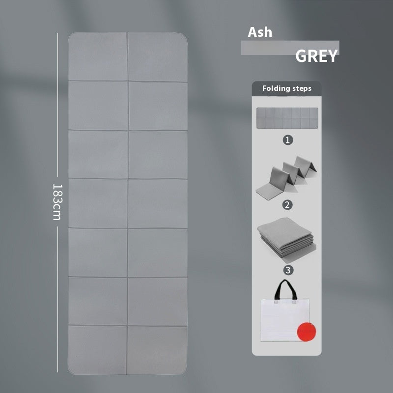 Gray folding mat with dimensions and folding steps on a gray background