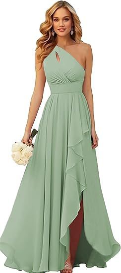 Woman wearing a long green dress with a one-shoulder design, holding a small bouquet.