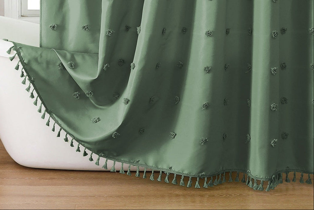 Green shower curtain with decorative elements in a bathroom setting