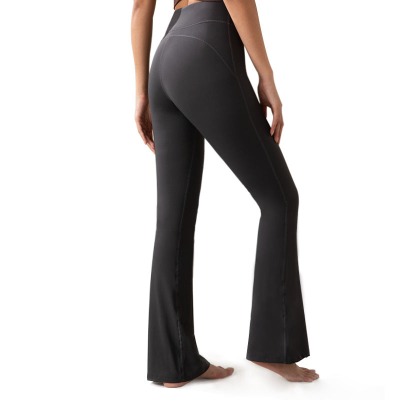 Black yoga pants worn by a person on a white background