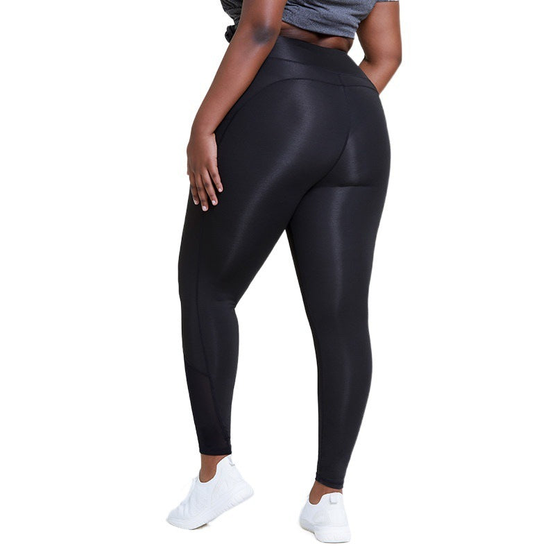 Person wearing black leggings on a white background