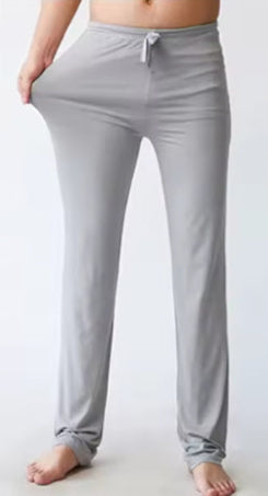 Gray lounge pants worn by a person on a white background