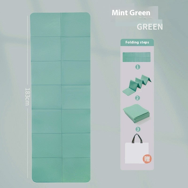 Mint green yoga mat with folding instructions on a light gray background