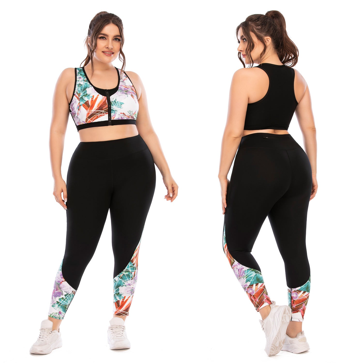 Woman wearing a sports bra and leggings with tropical print on a white background