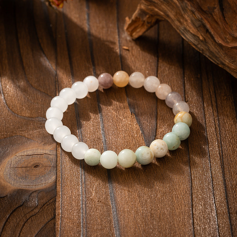 Multicolored beaded bracelet on a wooden surface
