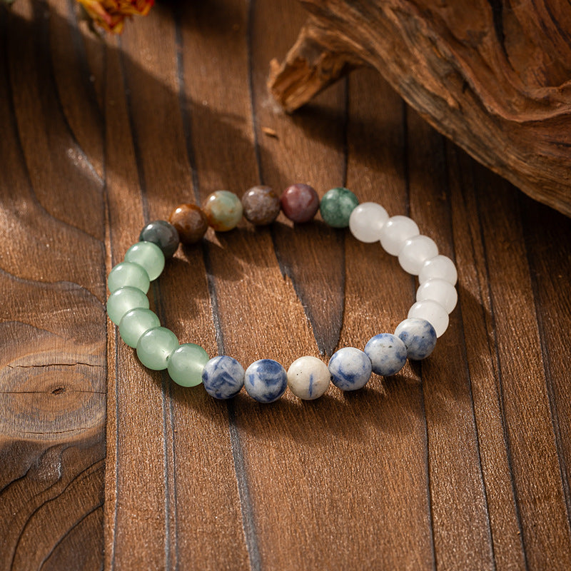 Multicolored beaded bracelet on a wooden surface