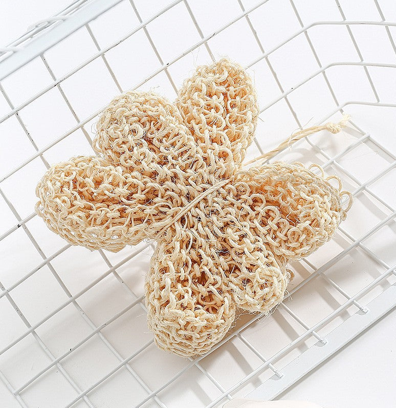 Natural loofah sponge on a white grid background