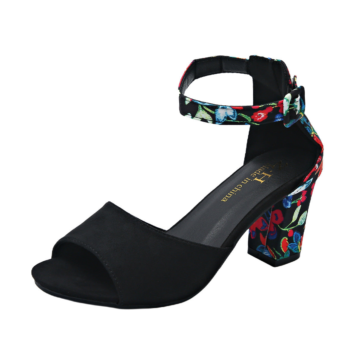 Black high-heeled sandal with colorful floral ankle strap on a white background