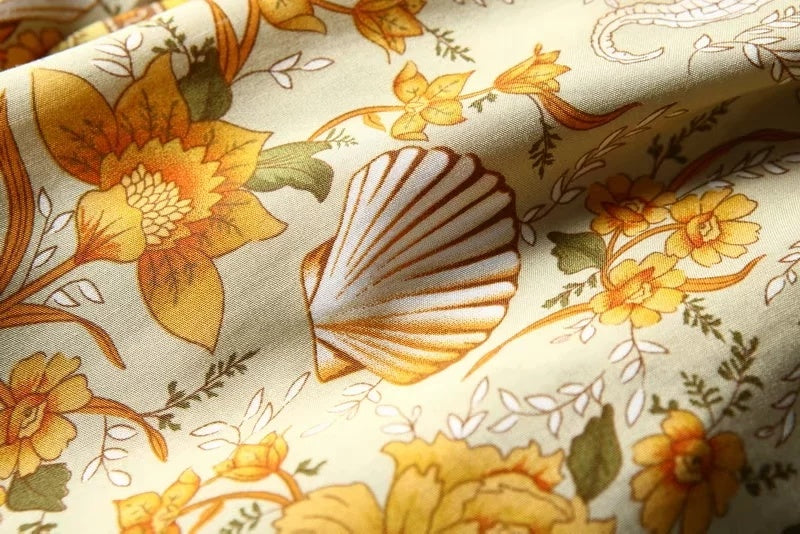 Close-up of fabric with floral and shell pattern