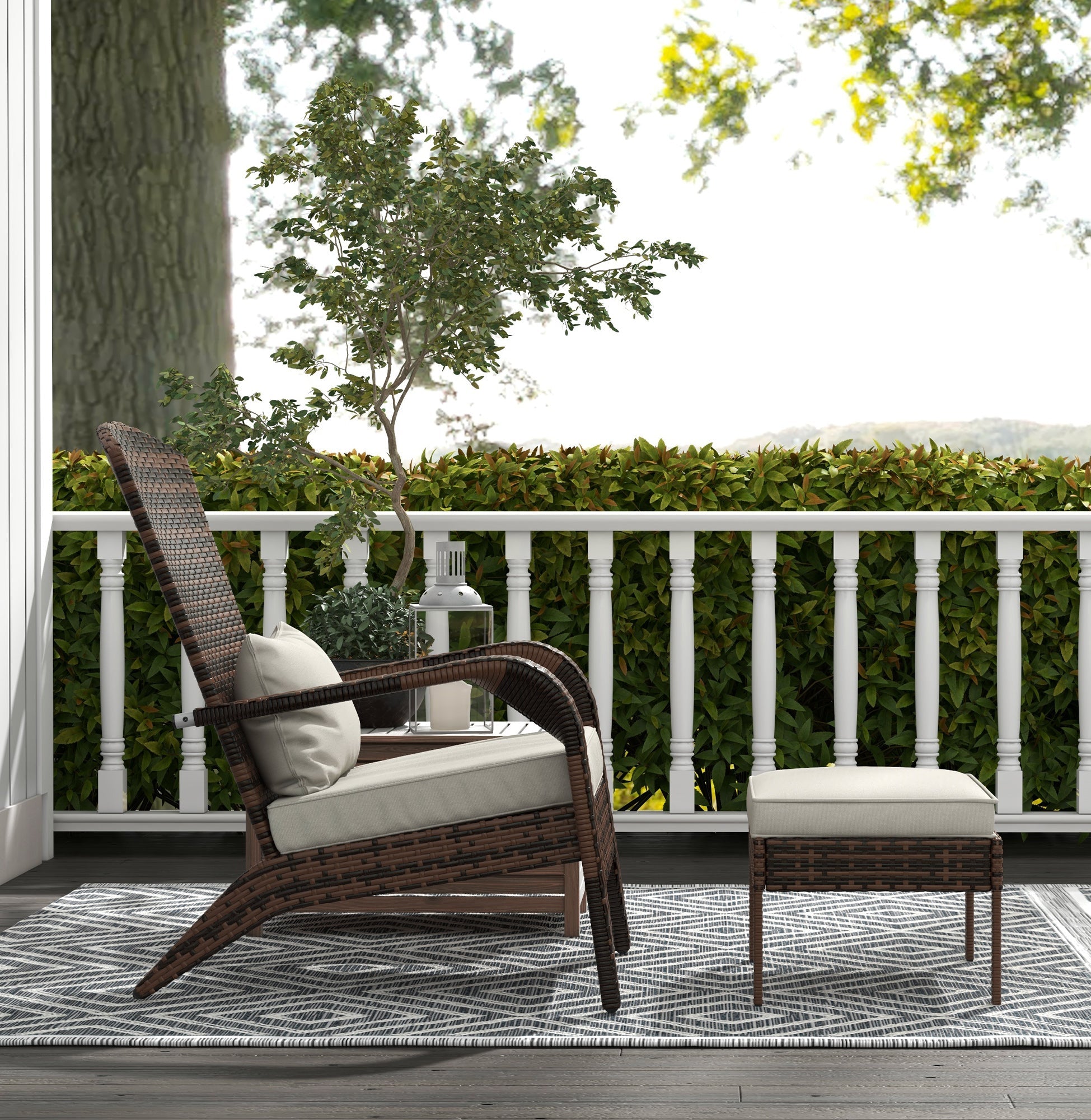 Outdoor furniture set on a deck with a white railing and greenery.