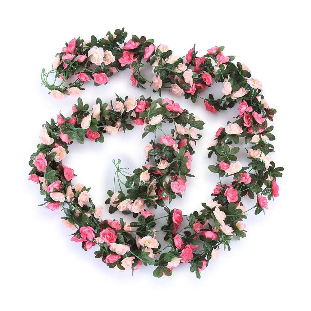 Artificial flower garland with pink and white flowers on a white background