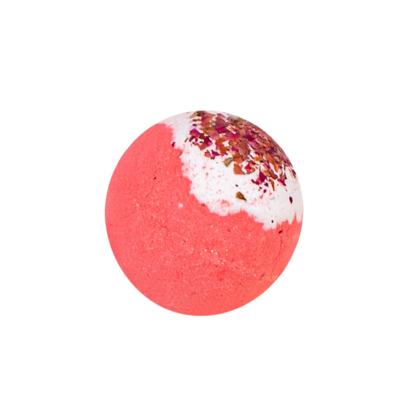 Pink bath bomb with white and multicolor speckles on a white background