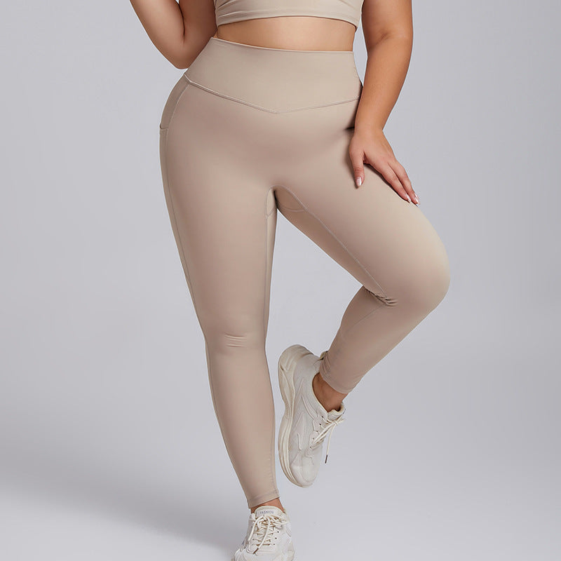 Beige leggings worn by a person on a light gray background