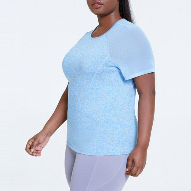 Woman wearing a light blue athletic shirt on a white background
