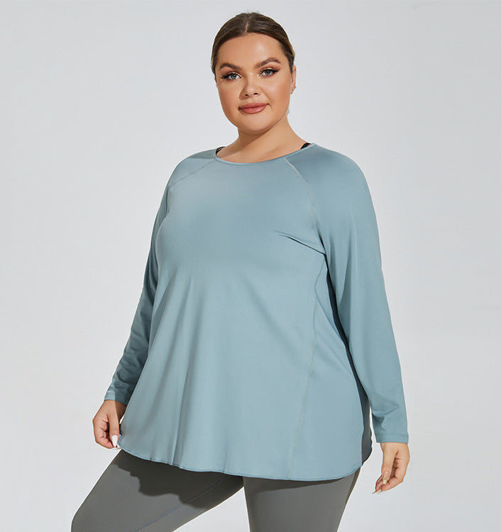 Woman wearing a light blue long-sleeve top against a white background