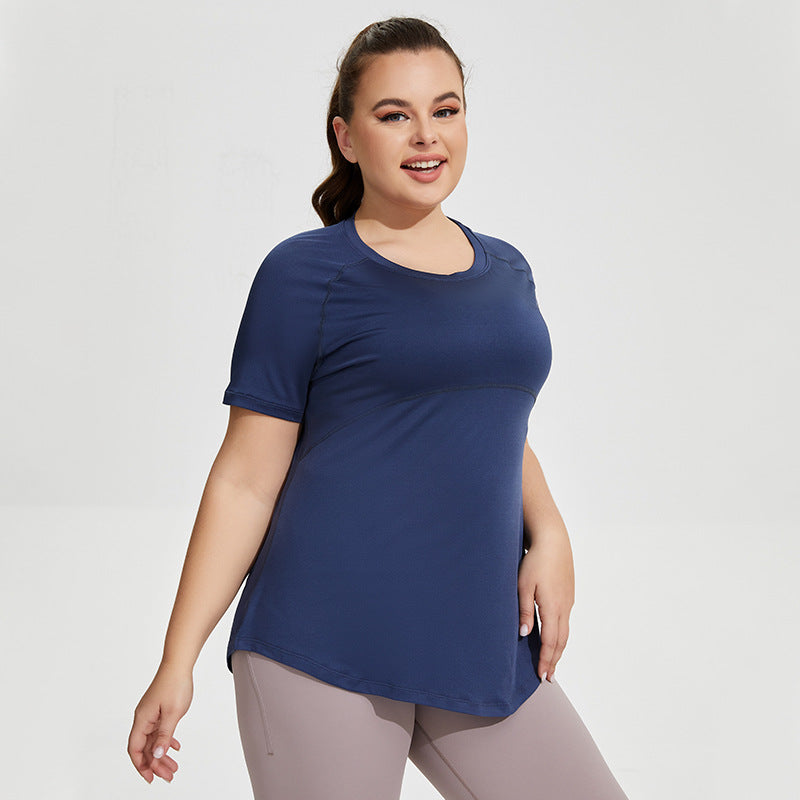 Woman wearing a blue t-shirt and gray leggings on a white background