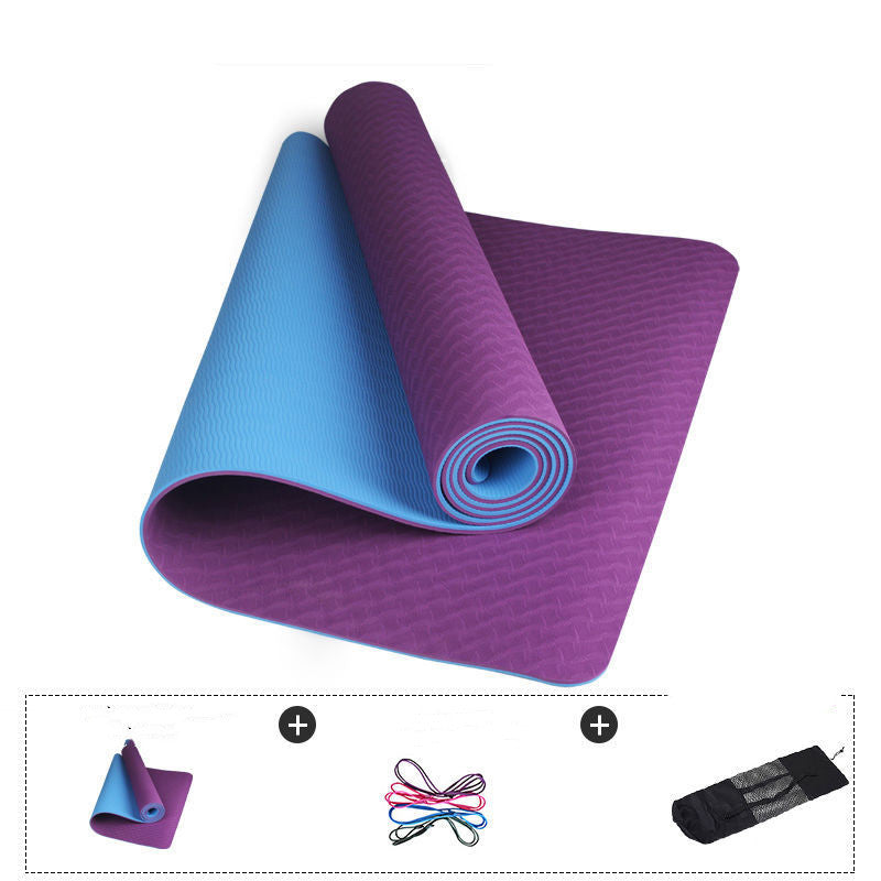 Purple and blue yoga mats on a white background