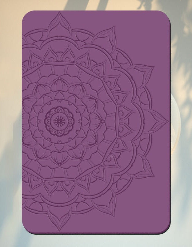 Purple mandala design on a card with blurred natural background
