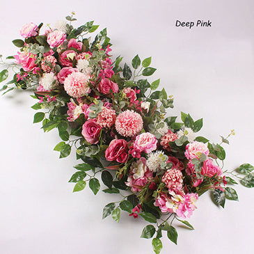 Floral arrangement with pink and green flowers on a white background