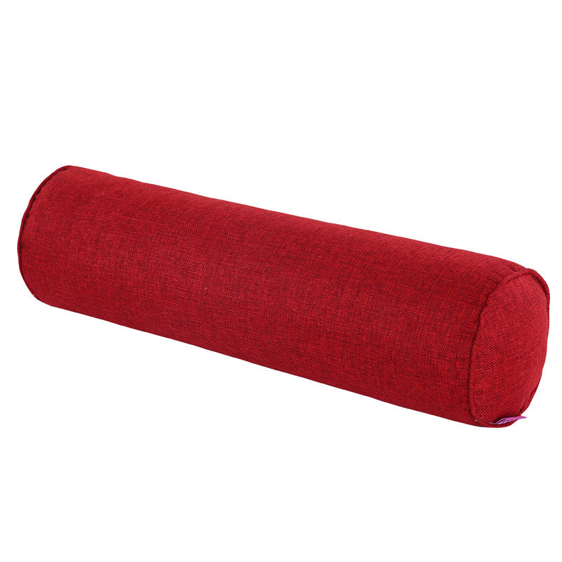 Red cylindrical pillow on a white background