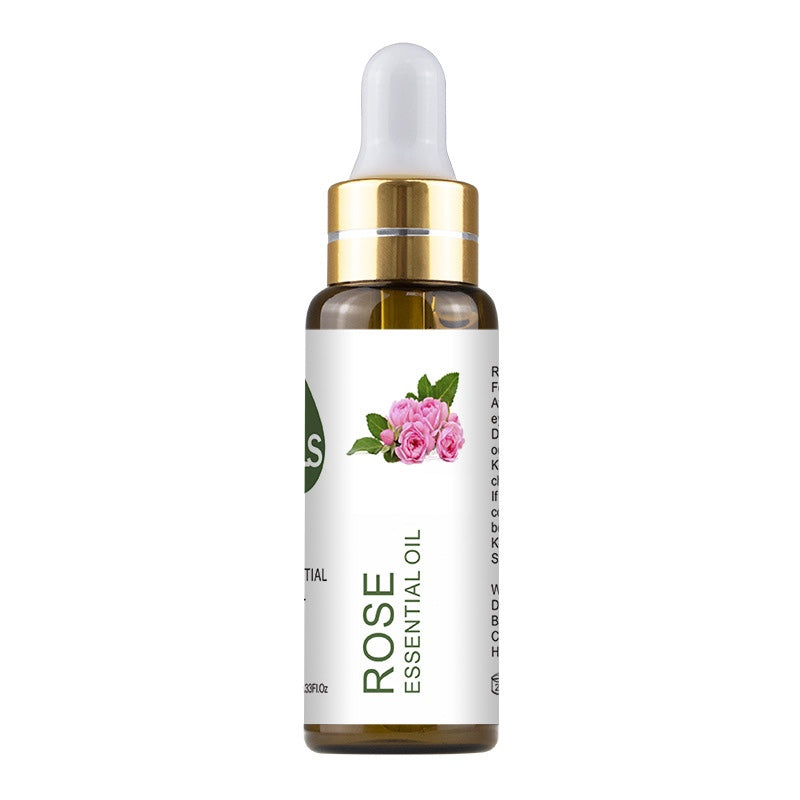 Rose essential oil bottle with dropper on a white background
