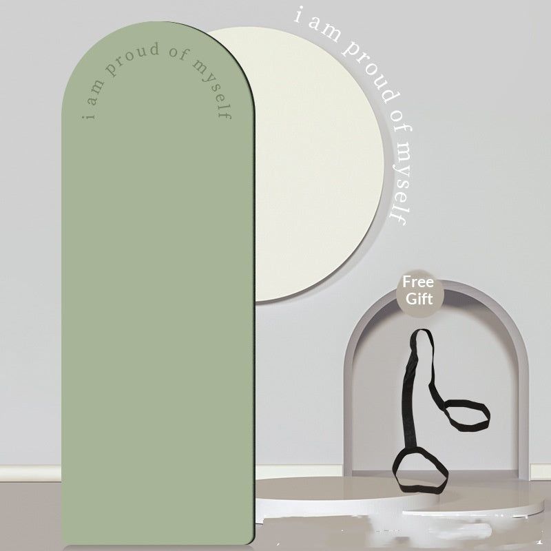 Decorative mirror with motivational text and a free gift tag on a plain background