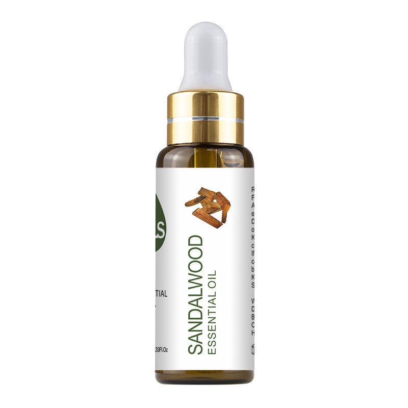 Sandalwood essential oil bottle with dropper on a white background