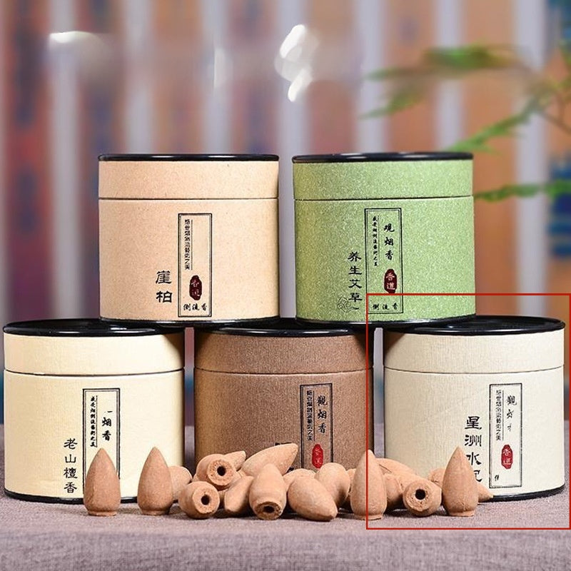 Set of incense containers with incense sticks on a blurred background