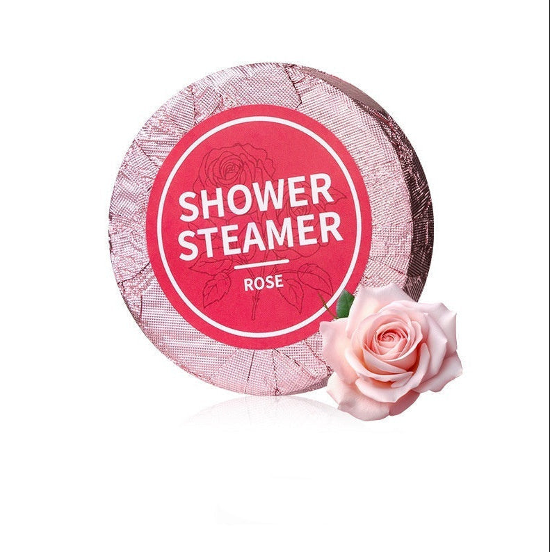 Shower steamer with rose design and text on a white background