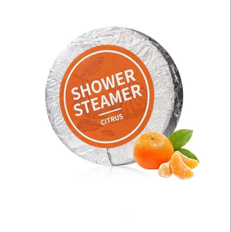 Shower steamer with tangerine flavor on a white background