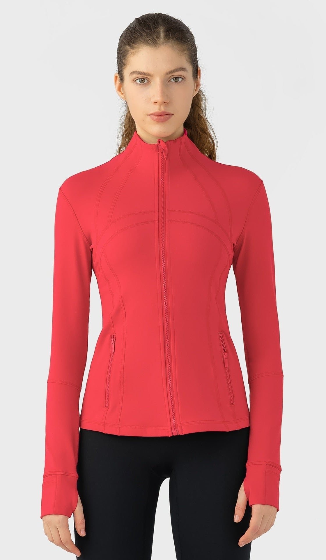 Woman wearing a red jacket on a white background