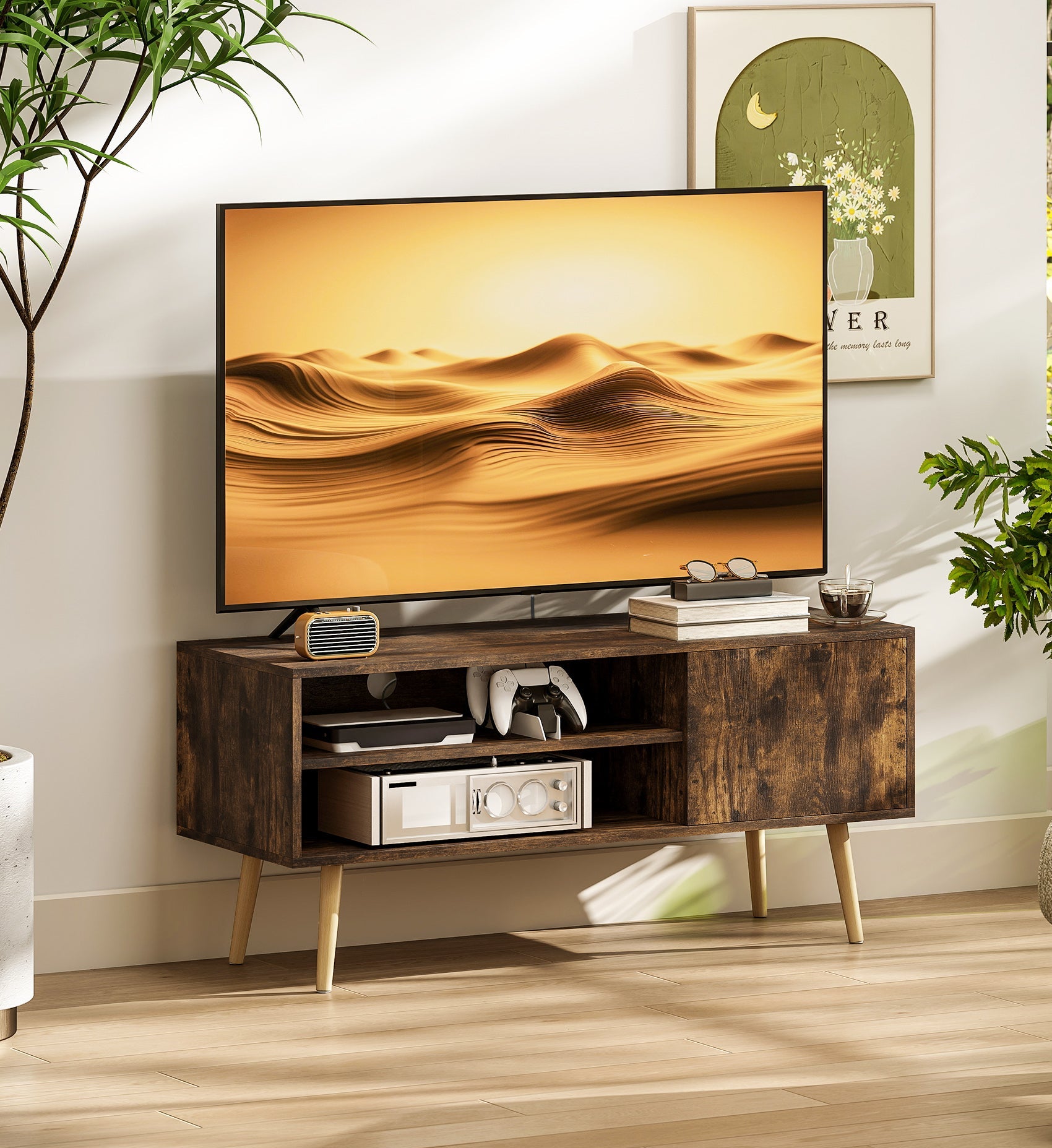 Wooden TV stand with a television displaying a desert scene, surrounded by plants and decor.