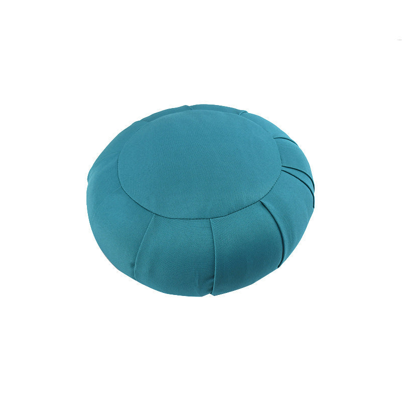 Teal meditation cushion on a white background