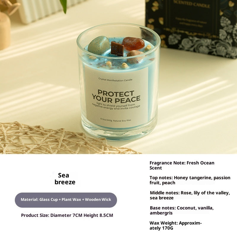 Candle with decorative elements on a textured surface, featuring product details.