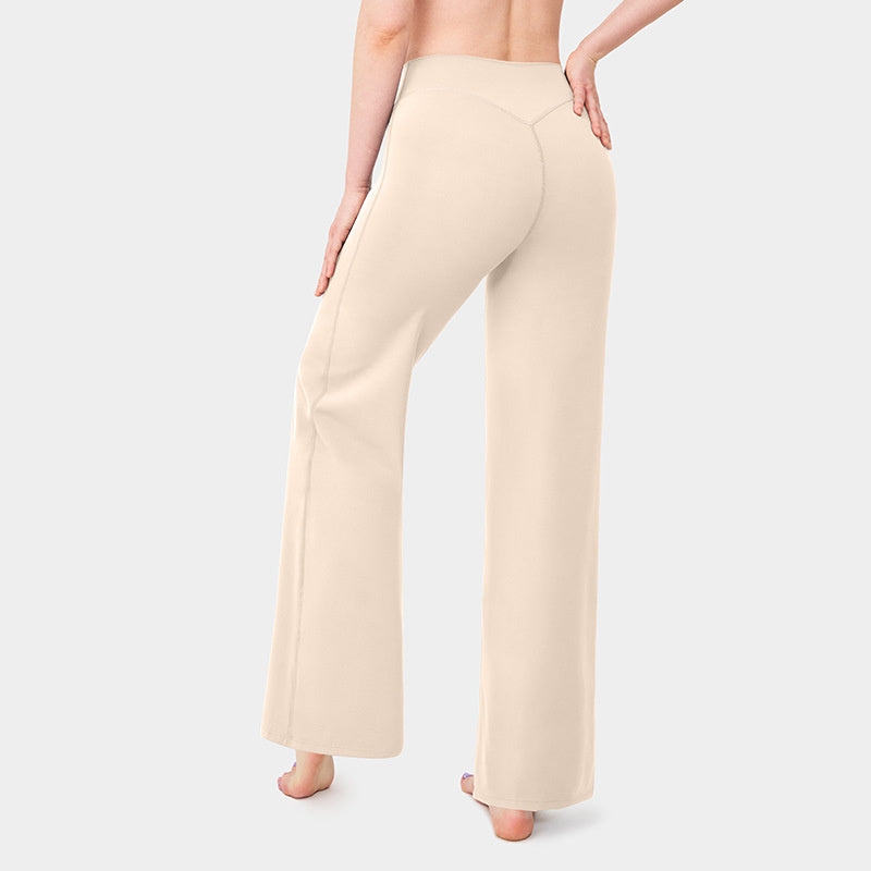 Beige wide-leg pants worn by a person on a light gray background