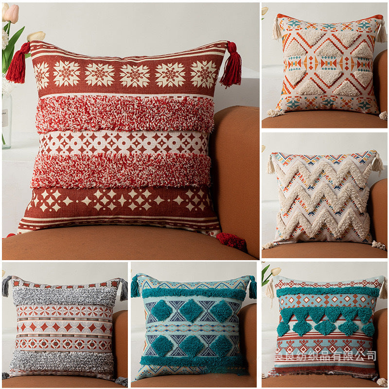 Collage of patterned cushions on a sofa with a neutral background