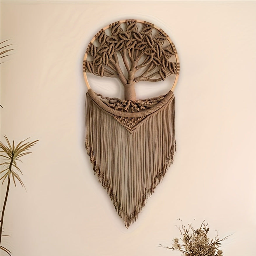 Wooden wall art with tree design and fringe on a beige background