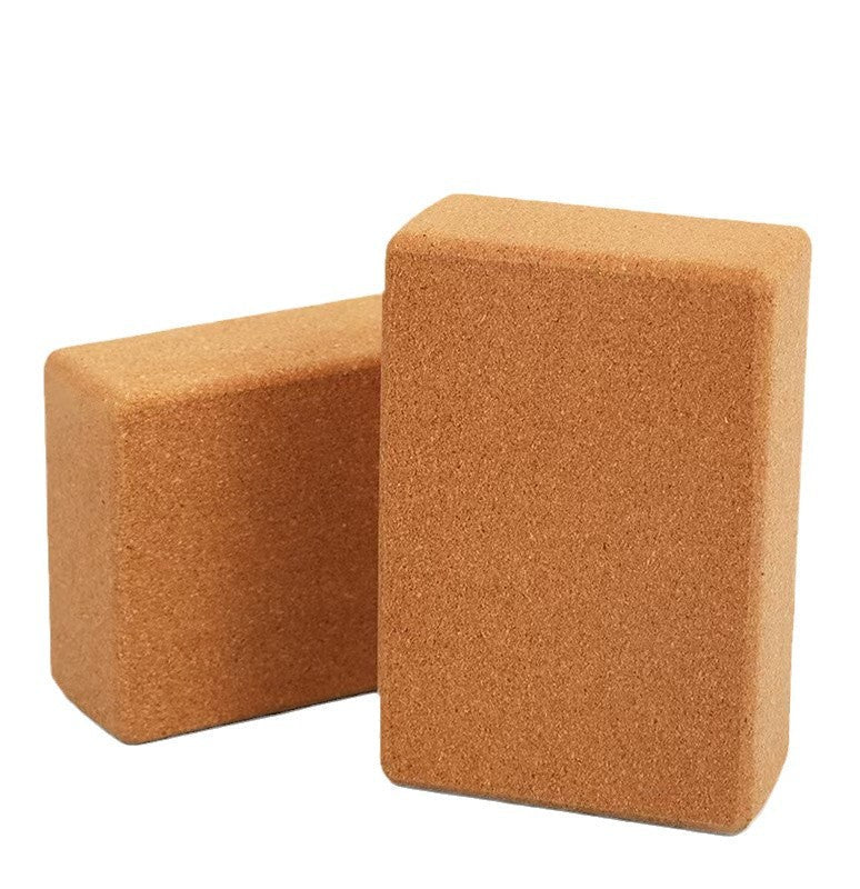 Two brown yoga blocks on a white background