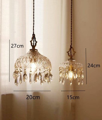 Two crystal pendant lights with measurements on a neutral background