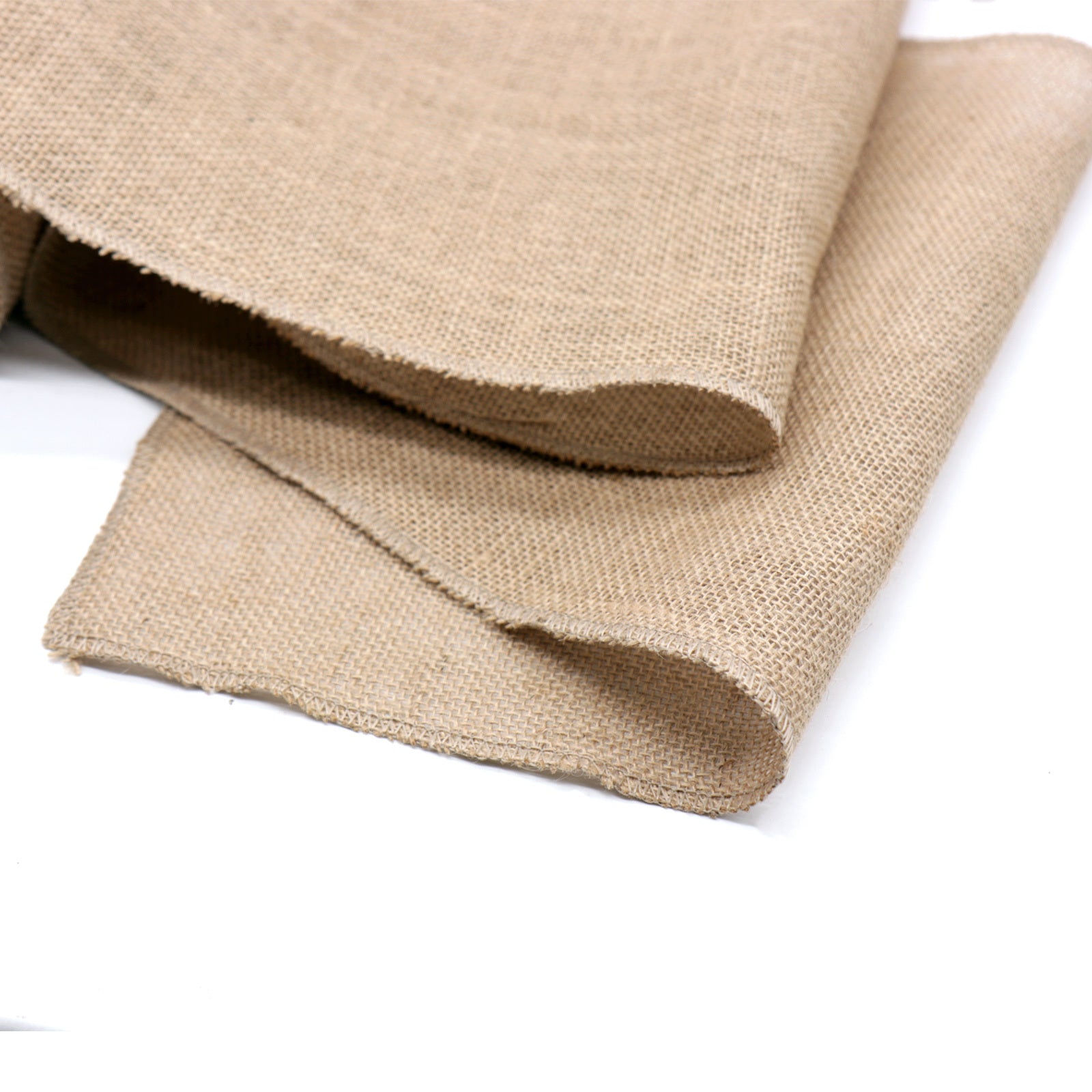 Folded piece of beige fabric on a white background