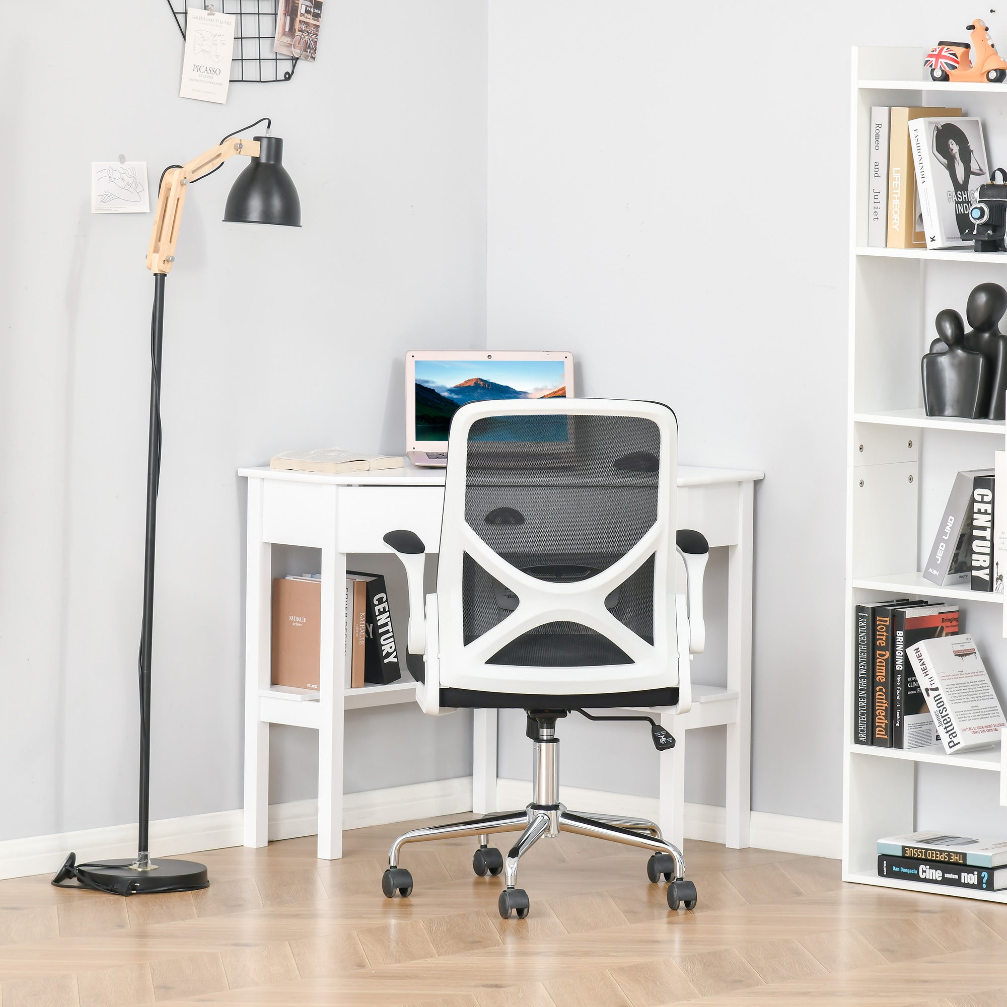 White office chair in a room with a desk, lamp, and bookshelf.