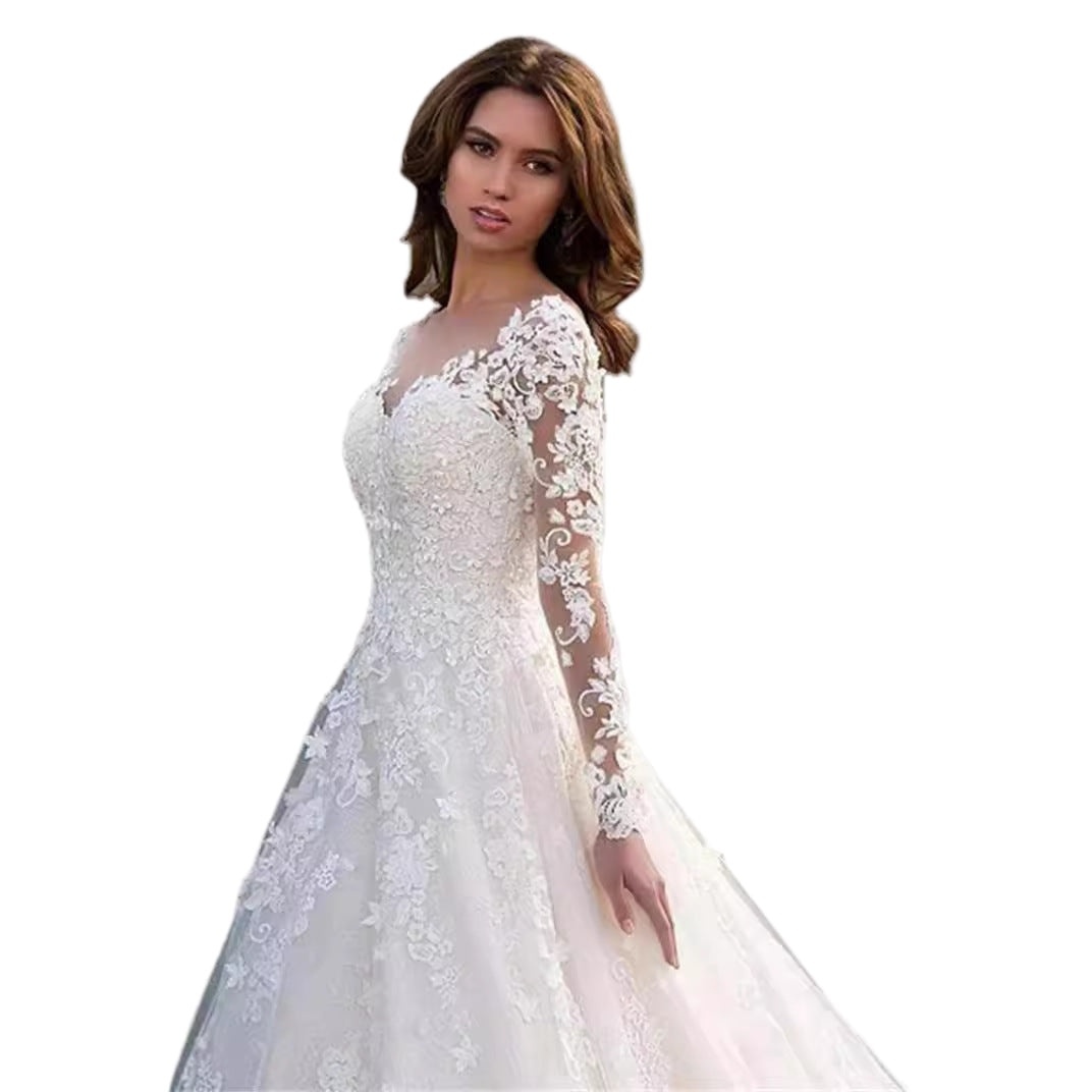 White lace wedding dress with long sleeves on a white background