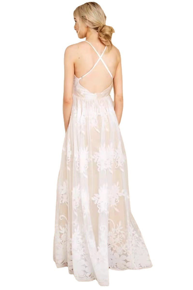 Woman wearing a white floral dress with thin straps on a white background
