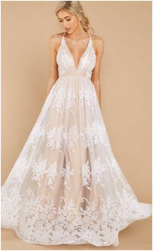 White lace wedding dress on a beige background
