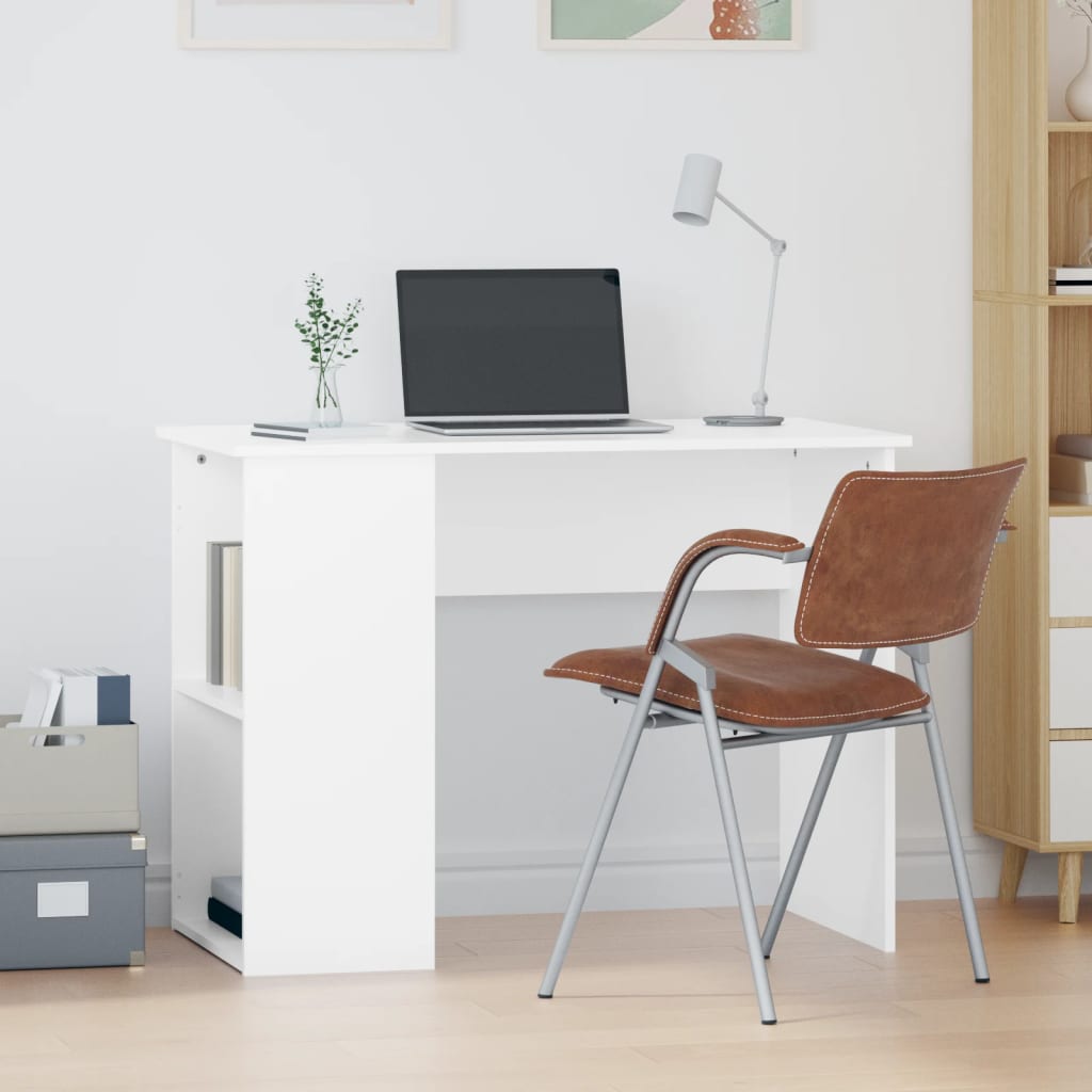 White desk with a laptop, lamp, and brown chair in a room with a bookshelf.